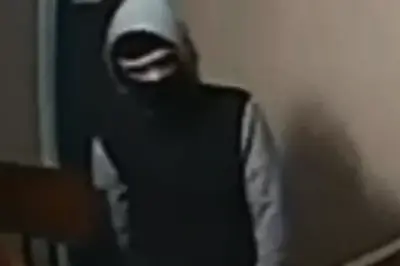 Shocked Mother Notices Masked Stranger with Crowbar Lurking Outside Scottish Apartment